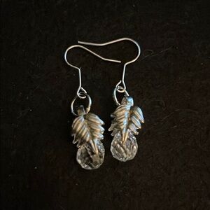 Elegant Silver Leaf Drop Earrings featuring a tear drop crystal